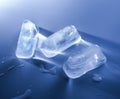 Three ice cubes. Close-up. Macro. White blue tone. View from above. Royalty Free Stock Photo