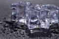 Three ice cubes with water drops isolated on black Royalty Free Stock Photo