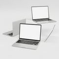 Three identical open laptops with blank screens arranged in a triangular formation Royalty Free Stock Photo