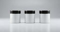 Three identical white cylindrical containers with black caps arranged in a row on a reflective surface Royalty Free Stock Photo