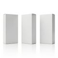 Three identical white rectangular boxes standing upright on a reflective surface Royalty Free Stock Photo