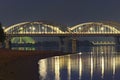 Three Illuminated Bridges At Night. Picturesque Landscape Of Dnipro River With Arched Railway Bridge, Darnytskyi Railroad Bridge