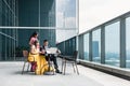 Three Indian business people talking during break at work Royalty Free Stock Photo