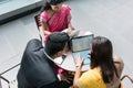 Three Indian business people talking during break at work Royalty Free Stock Photo