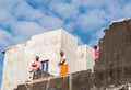 Three Indian men on a rooftop