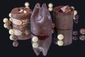 Three individual chocolate cakes on a mirror Royalty Free Stock Photo