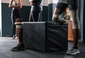 Three people with prosthetic legs stand together in gym Royalty Free Stock Photo