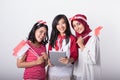 Three indonesian woman using tablet pc