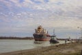 Three industrial cargo ships sailing down the Welland Canal. Royalty Free Stock Photo