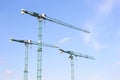 Three industrial construction tower cranes. Royalty Free Stock Photo