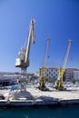 Three industrial cranes