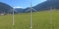 Three industrial wind turbines capable of supplying power to an entire village in a remote mountainous region. 3d render