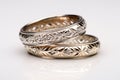 three intertwined metallic rings with engravings Royalty Free Stock Photo