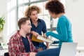 Three involved students sharing ideas and opinions about differe Royalty Free Stock Photo