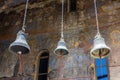 Three iron bells hanging from the ceiling in Church of Dormition, Vardzia cave monastery complex, Georgi Royalty Free Stock Photo