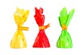 Three isolated colorful candies