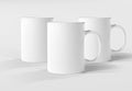 Three isolated mugs mockup on white. Blank coffee cups template. 3D rendering Royalty Free Stock Photo