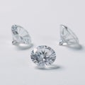 Three isolated shimmering diamonds against a purewhite background Royalty Free Stock Photo