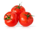 Three isolated tomatoes on white background. Royalty Free Stock Photo