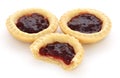 Three jam tarts, one with a bite taken Royalty Free Stock Photo