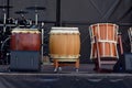 Three Japanese Taiko Nagado and Okedo drums standing in a row on stage