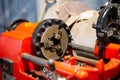 Three-jaw lathe chuck in red threading machine Royalty Free Stock Photo