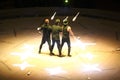 Three jugglers / circus performers at work on stage.