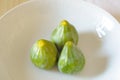 Organic juicy green figs in white plate Royalty Free Stock Photo