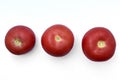 Three juicy red tomatoes on a white background Royalty Free Stock Photo