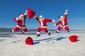 Three Jumping Santa Claus outdoors
