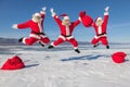 Three Jumping Santa Claus outdoors