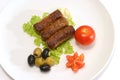 Three kabob with olives and tomatoes Royalty Free Stock Photo