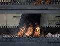 Three kebabs with juicy cuts of meat, cooked outdoors on the grill at the fair