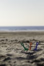 Three kid spades on a empty beach