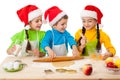 Three kids with Christmas cooking Royalty Free Stock Photo