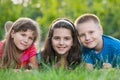 Three kids on the grass Royalty Free Stock Photo