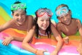 Three kids in the pool Royalty Free Stock Photo
