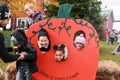 Three kids posing in a pumpkin Royalty Free Stock Photo