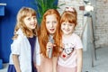 Three kids sing a song in a microphone. Group. The concept is ch Royalty Free Stock Photo