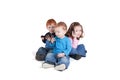 Three kids using mobile phones Royalty Free Stock Photo