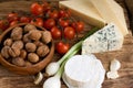 Three kinds of cheese and several kinds of vegetable Royalty Free Stock Photo