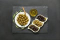 Three kinds of selected olives and olive oil.