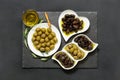 Three kinds of selected olives and olive oil. Royalty Free Stock Photo