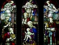The three Kings visiting baby Jesus with presents in stained glass