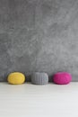 Three knitted poufs