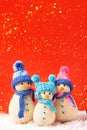 Three knitted snowmen