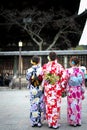 Three ladies in kimono at Yasaka street in Kyoto in the evening.