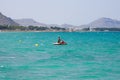 Three ladies on a paddle boat during holidays in Alcudia bay, Majorca