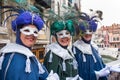 Three ladies wearing costumes for carnival