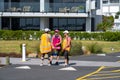 Three lady officials standing on track near Kulim Park during event